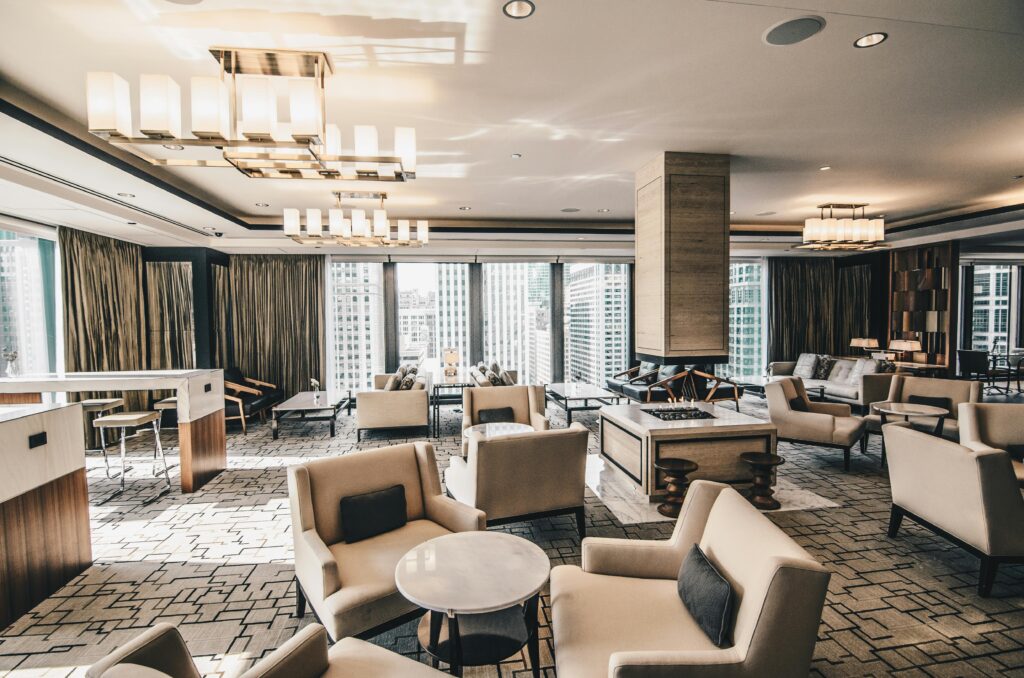A contemporary hotel lounge in Chicago featuring elegant furniture and large windows.